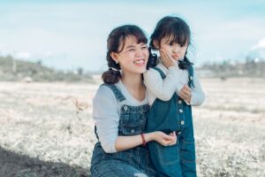 Heartfelt mothers' day message characterized by mother and daughter in matching jumpsuits