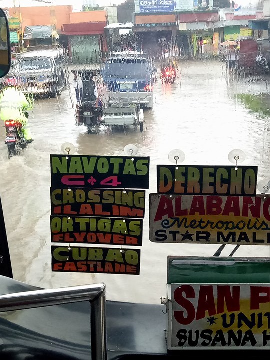 Bus braves the flooded streets in San Pedro Laguna