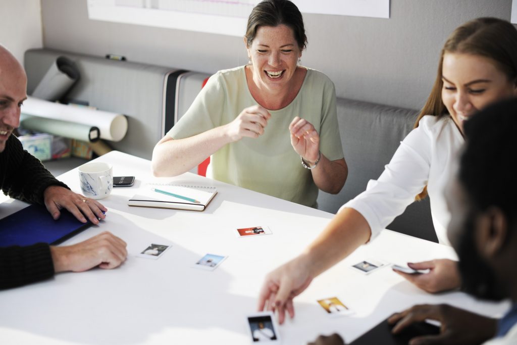 Stress management techniques discussed by the the group characterized by group of people huddled together in an office set up