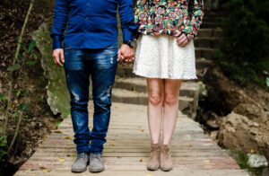 a couple holding hands showing workplace romance