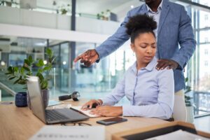 female employee remembering the signs of sexual harassment at work