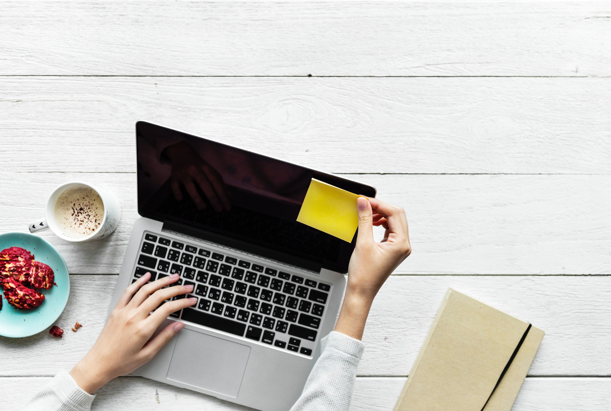 an employee writing an article about their prodcu following the copywriting tips from FilWeb Asia Inc. in a laptop