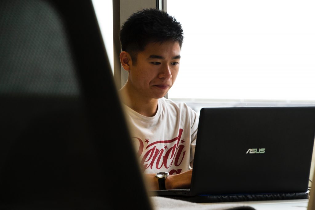 man staring at a laptop - millennial employees