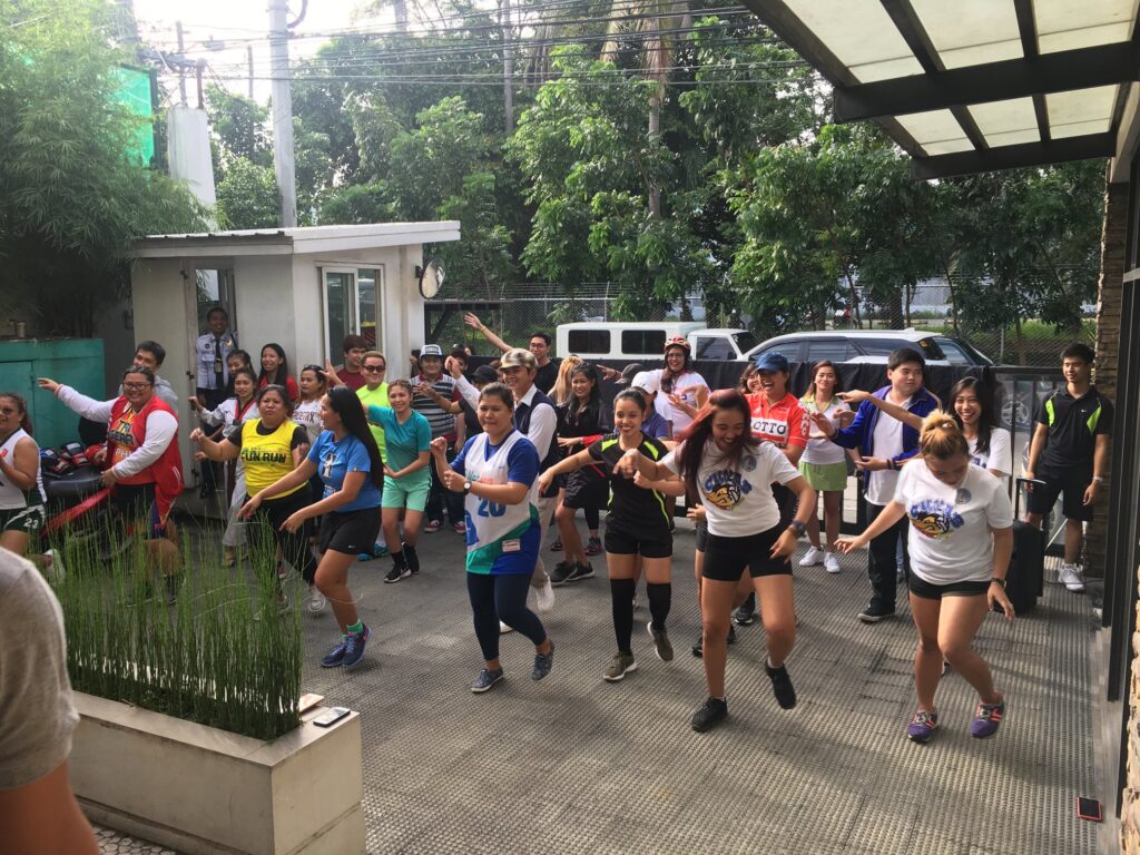 Employees do zumba as part of FilWeb Asia in 2018 events