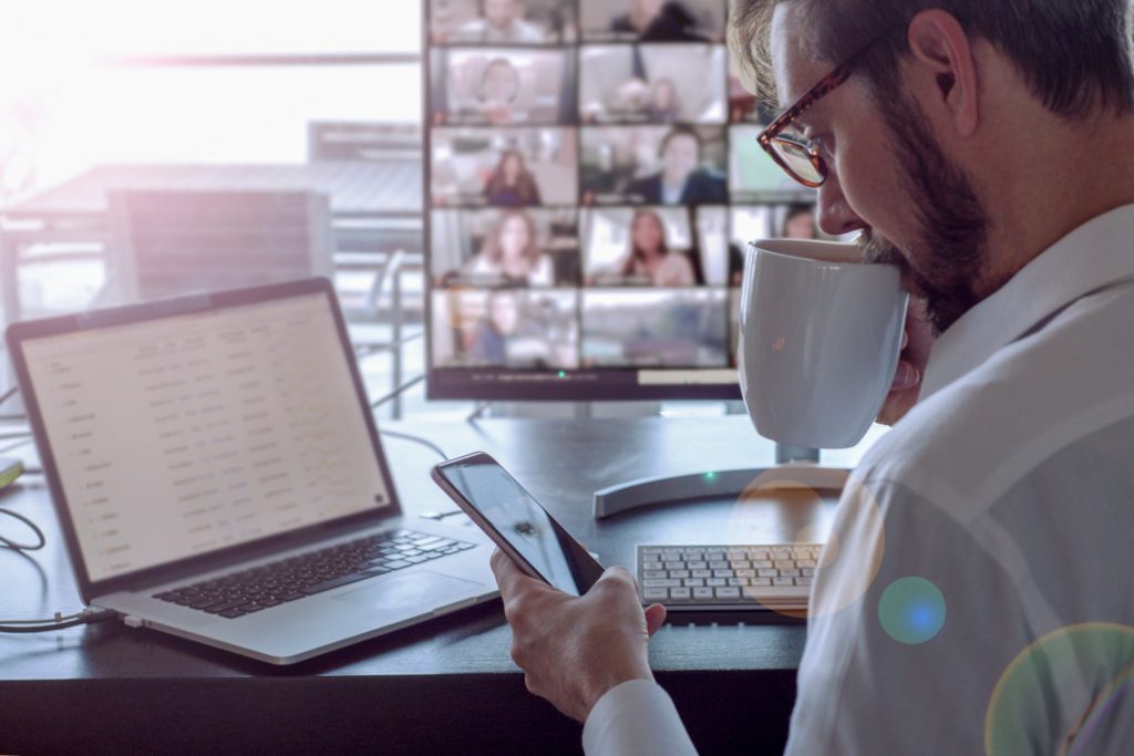 businessman working from home holding online meeting with the team