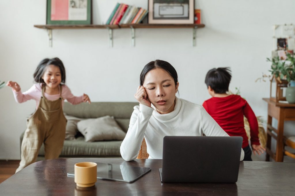 woman working at home stressed