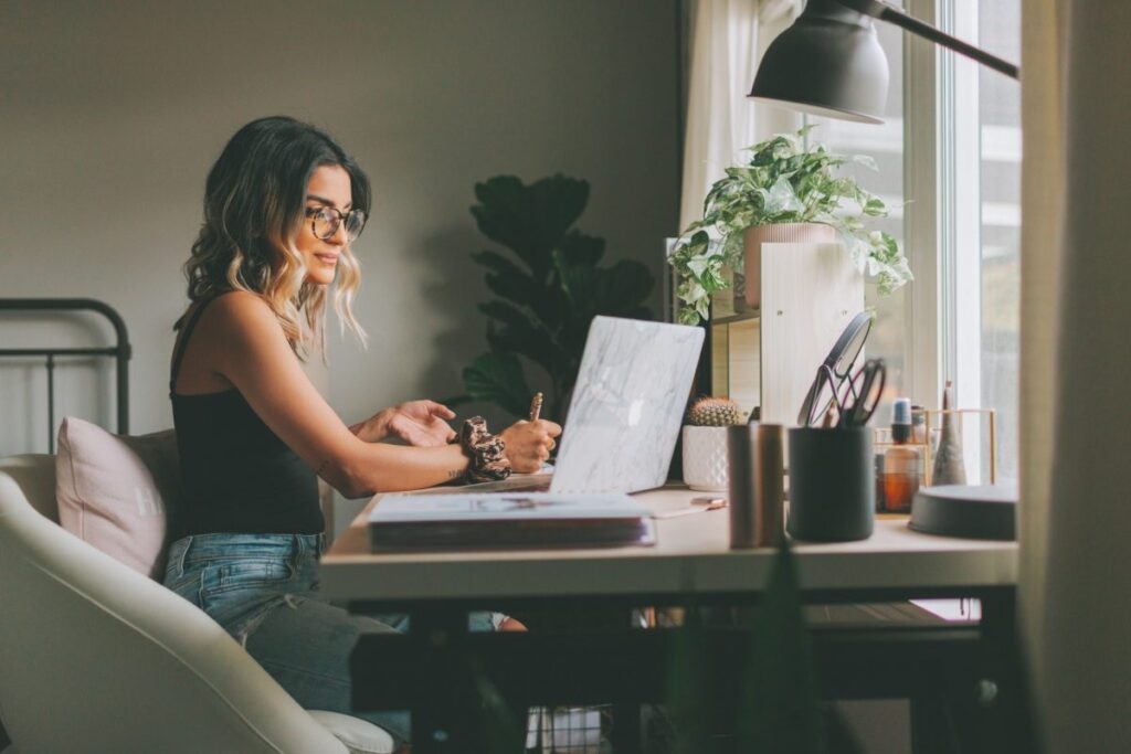 a young woman being productive in a work from home setup