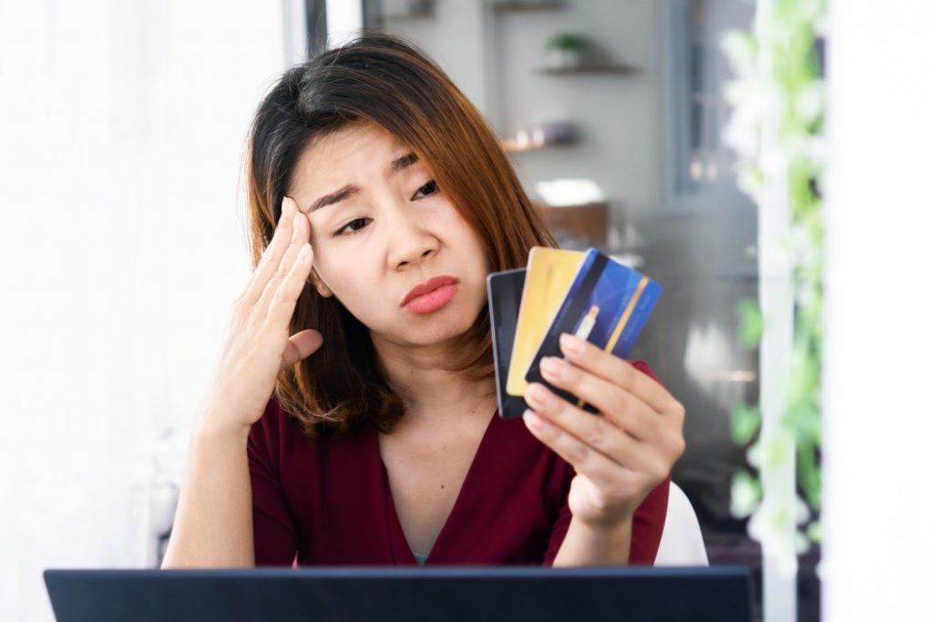 Filipino freelancer holding cards