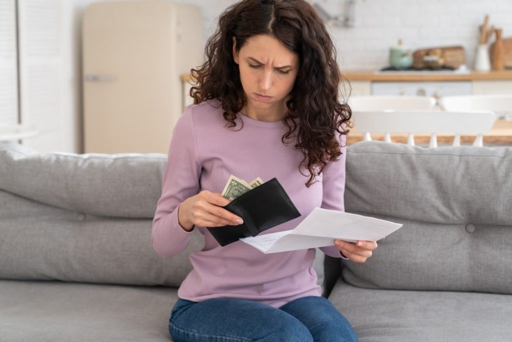 woman thinking about how to budget her money