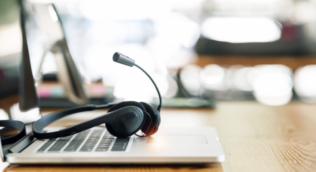 headset on desk with laptop computer at bpo industry in the philippines