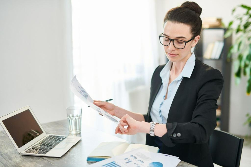 woman checking time while at work