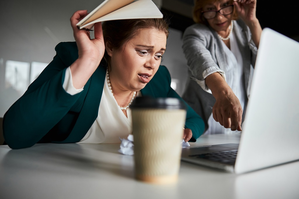 tensed employee under tight micromanagement at work