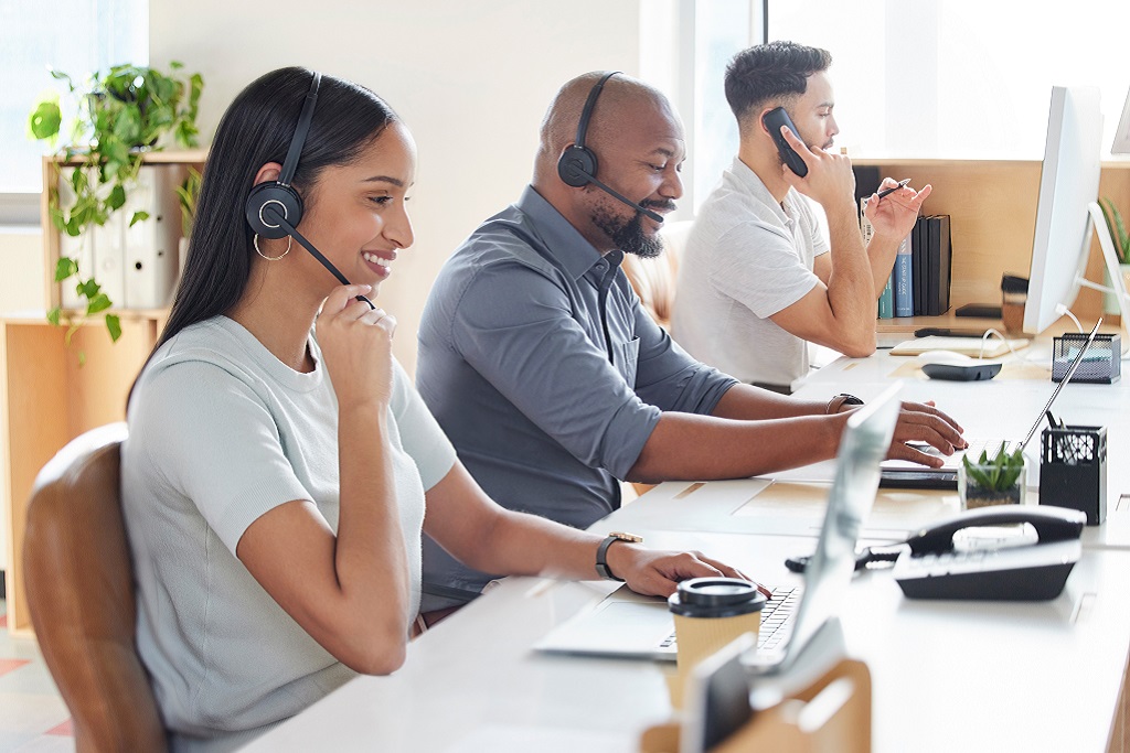 customer service team happily assisting clients with a smile