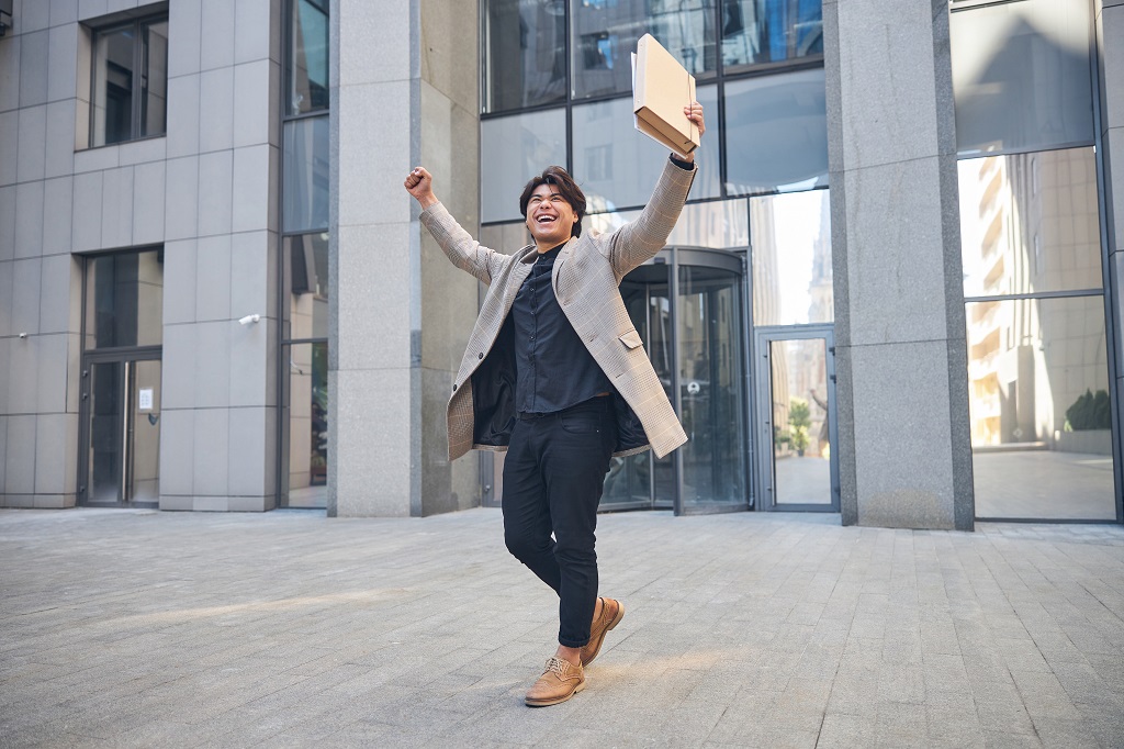 young professional celebrating his achievements