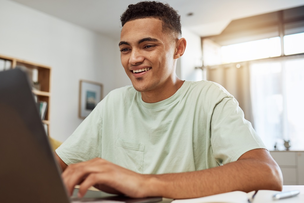 professional writer typing a blog content using his laptop