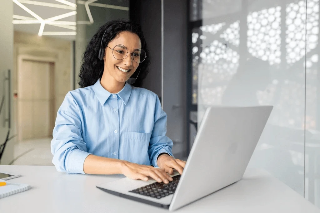 businesswoman researching the latest web development trends on her laptop