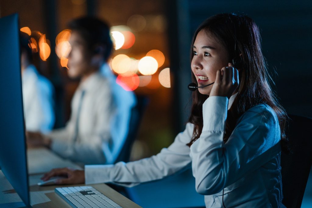 Asia young call center team or customer support service executive using computer.